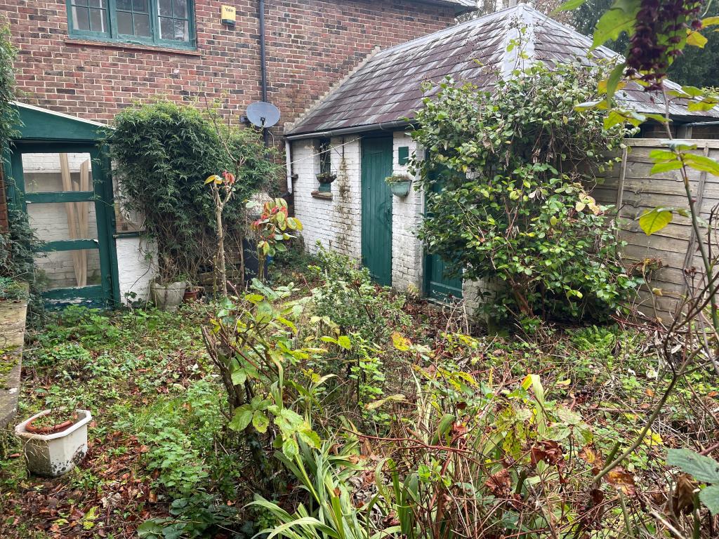 Lot: 24 - PART-POSSESSION INVESTMENT WITH POTENTIAL PRODUCING £20,820 PER ANNUM - Rear garden and outside stores